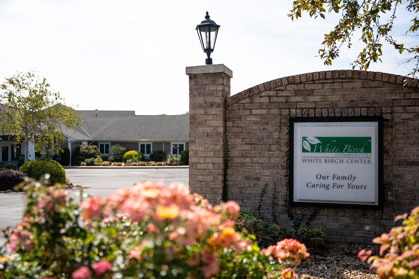 A picture of White Birch Communities building, including thier entrance sign